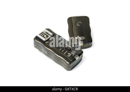 A black camera transmitter and remote on a white background. Stock Photo