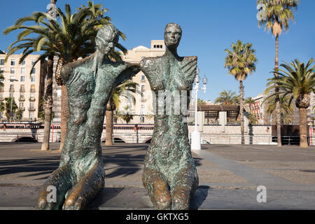 A bronze statue in Barcelona. Parella (Couple) by artist Lautaro Díaz Silva. Stock Photo