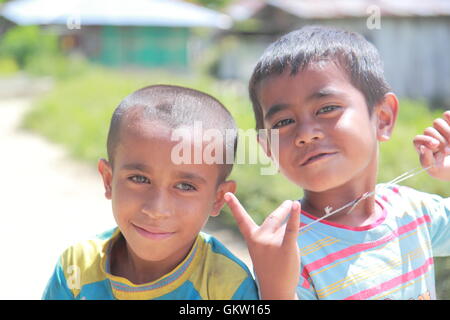 Local children pose toward camera in Moni village in Flores Indonesia. Stock Photo