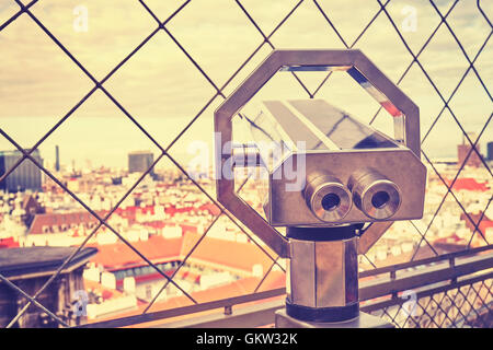 Vintage toned tourist binoculars over Vienna, view from the north tower of St. Stephen's Cathedral. Stock Photo