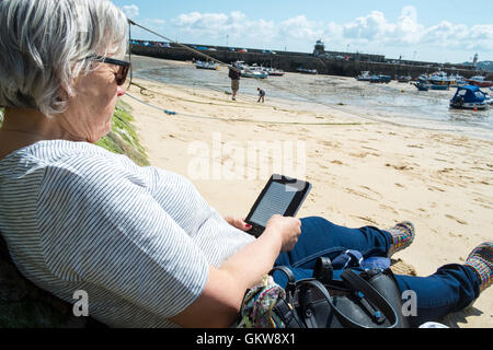 Kindle Paperwhite on beach number 3598 Stock Photo