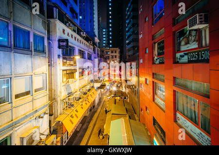 View of a narrow street at night, from the Central–Mid-Levels Escalator, in Hong Kong. Stock Photo