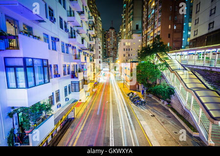 View of a narrow street at night, from the Central–Mid-Levels Escalator, in Hong Kong. Stock Photo