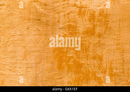 decorative antique look background texture of a terra cotta colored wall in Tuscany Stock Photo