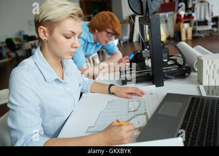 Engineer looking at sketch during work Stock Photo