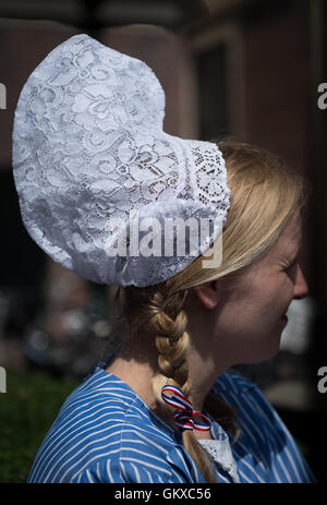 Traditional lace cap worn by cheese seller at the Alkmaar cheese market, Netherlands Stock Photo