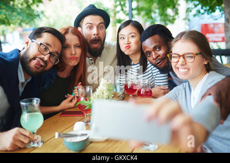 Group of freinds making funny faces for selfie Stock Photo