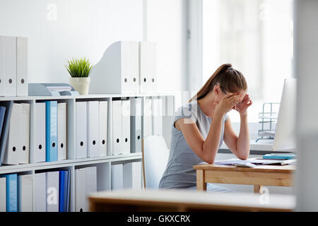 Concentrated businesswoman reading information in document Stock Photo