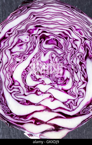 Half a Red Cabbage in close up on a dark background Stock Photo