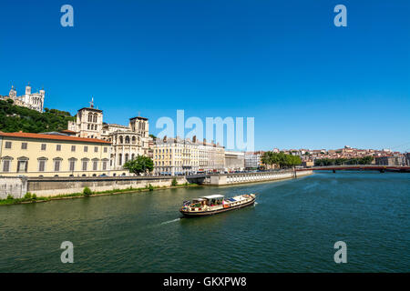 Lyon. Barge on the Saone river past the cathedral Saint Jean. Unesco World Heritage. Rhone department. Rhone-Alpes. France Stock Photo