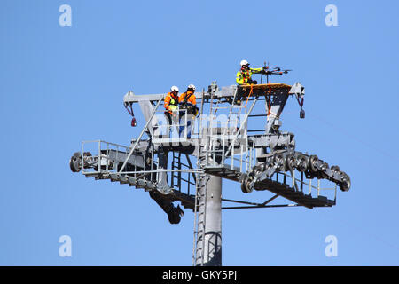 El Alto, Bolivia, 23rd August 2016. A technician checks a drone that is being used to carry a light synthetic cable between the pylons of a new cable car / gondola lift that is under construction. This is the first part of the process to install the final steel cable that will carry the gondolas. This cable car between Rio Seco and La Ceja in El Alto is one of a second phase of cable car lines that are part of an ambitious project to relieve traffic congestion. 3 routes from the first phase are already operating between the cities of La Paz and El Alto. Credit:  James Brunker / Ģ����ý Live News Stock Photo
