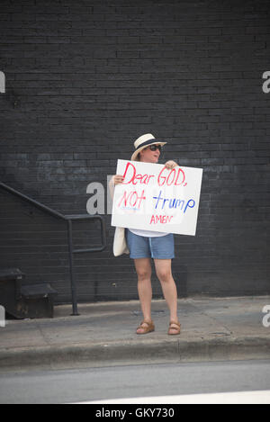 Austin, Texas, USA. 23rd Aug, 2016. A Hillary Clinton supporter holds an anti-Donald Trump banner during the protest at the FOX News presidential fundraiser in downtown Austin, Texas Credit:  Sandy Carson/ZUMA Wire/Alamy Live News Stock Photo