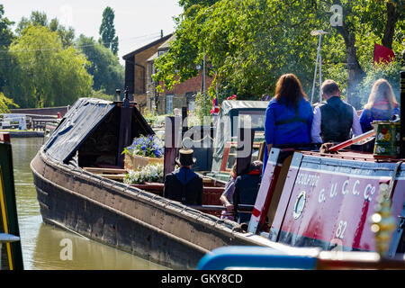 Stoke Bruerne, Northamptonshire, U.K. 24th August 2016. David Blagrove OBE, who died on 12th August  2016, had his last trip on the Grand Union Canal today aboard NB Sculptor which departed from his home at The Wharf at 10.30am to Blisworth Tunnel and back accompanied by his family, before his funeral at St Mary’s church, Stoke Bruerne. David  was a lock keeper, working boatman and campaigner of inland waterways all his life. Credit:  Keith J Smith./Alamy Live News Stock Photo
