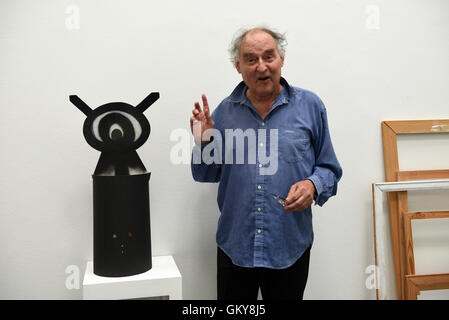 Duesseldorf, Germany. 24th Aug, 2016. Artist Harald Naegeli, who was widely known as 'the sprayer of Zurich' in the 1970s, stands in his atelier, that was moved to the museum for the exhibition, during the press tour of his exhibition 'Harald Naegeli - Der Prozess' at the Stadtmuseum in Duesseldorf, Germany, 24 August 2016. The exhibition is open at the Stadtmuseum in Duesseldorf from 26 August 2016 to 1 January 2017. Photo: Horst Ossinger/dpa/Alamy Live News Stock Photo