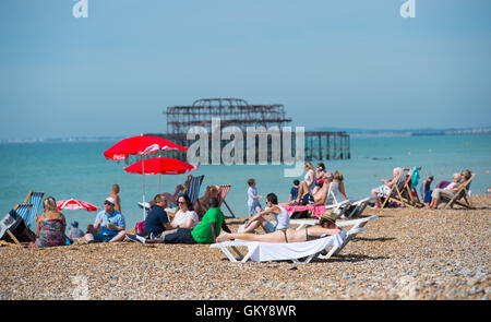 Brighton, UK. 24th Aug, 2016. Crowds flock to Brighton beach to enjoy the hot sunshine today with temperatures forecast to reach over thirty degrees centigrade as the heatwave weather continues throughout southern Britain Credit:  Simon Dack/Alamy Live News Stock Photo