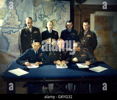 Dwight D. Eisenhower, General of the Army, with officers of the Supreme Command of the Allies during the Spring of 1944. Seated, l-r: Air Chief Marshall Sir Arthur Tedder, Deputy Supreme Commander;Eisenhower;General Sir Bernard L. Montgomery, Commander-in-Chief of British Forces. Standing, l-r: Lt. Gen. Omar N. Bradley, Senior Commander of U.S. Ground Forces; Admiral Sir Bertran Ramsey, Allied Naval Commander; Air Chief Marshal Sir Trafford Leigh-Mallory, Air Commander-in-Chief; Lt. Gen. Bedell Smith, Chief of Staff. Stock Photo