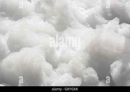 Close up detail of thick white soapy foam bubbles in a full frame background texture Stock Photo