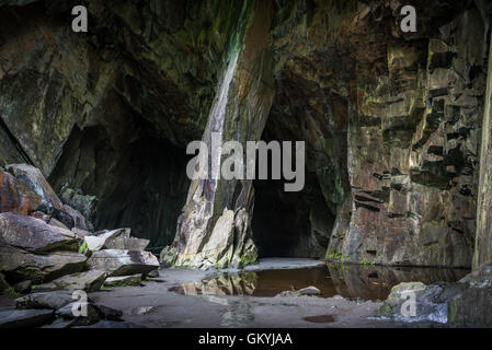 'The Cathedral', is a 40-foot (12 m) high main chamber in an old slate mine in the little langdale valley. It is lit by two wind Stock Photo