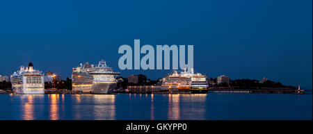 Luxury cruise ships docked at Ogden Point harbor at twilight-Victoria, British Columbia, Canada. Stock Photo