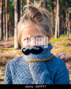 Beautiful blond girl with a black mustache Stock Photo