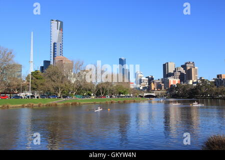 Athletes train rowing in Yarra river in Melbourne Australia. Stock Photo