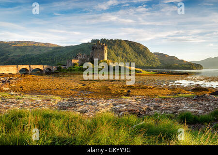 Evening sunlight on the castle at Eilean Donan in the Western Highlands of Scotland Stock Photo
