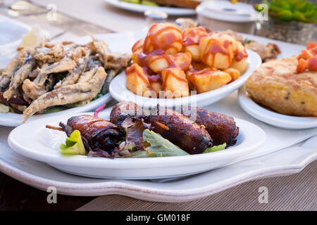 A selection of Mallorcan Tapas dishes, including dates wrapped in bacon pictured front Stock Photo