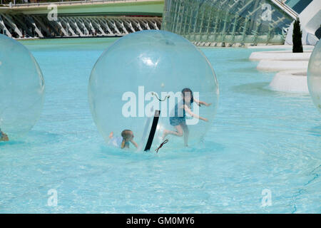 Children inside a water walking ball at the science park  at Valencia Stock Photo