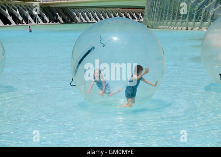 Children inside a water walking ball at the science park  at Valencia Stock Photo