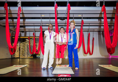 Olympians(L-R): Nicola Adams, Louis Smith and Jade Jones pose with their 2012 medals at a photocall in May 2013 in London, U.K. Stock Photo