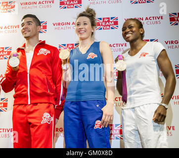 Olympians: (L-R) Louis Smith, Jade Jones and Nicola Adams pose with their 2012 medals at a photocall in May 2013. London, U.K. Stock Photo