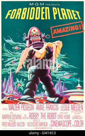 Forbidden Planet (1956) directed by Fred McLeod Wilcox and starring Walter Pidgeon, Anne Francis, and Leslie Nielsen. A star ship investigates a colony that has lost contact and comes face to face with the power of the id. See description for more information. Stock Photo