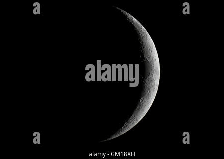 Moon waxing crescent. Young Moon. Crescent moon on black sky. Waxing Crescent. Stock Photo