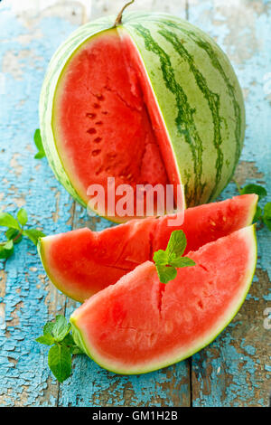 Fresh watermelon sliced with mint close up on the table Stock Photo