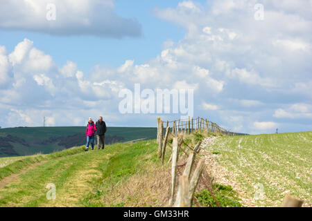 A couple walking on the South Downs in East Sussex, United Kingdom Stock Photo