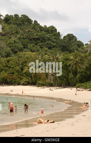 Costa Rica beach; Sunbathers on the beach, Manuel Antonio National Park, Pacific coast, Costa Rica, Central America Stock Photo