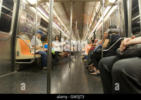 People are riding subway in New York CIty. Stock Photo