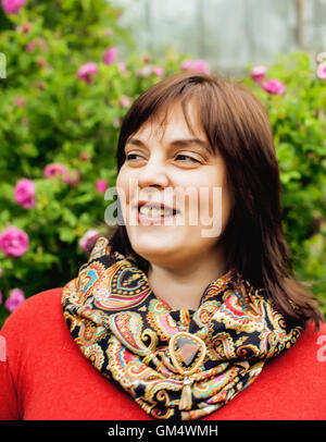 pretty modern mature fat woman outside wearing glasses, emotional