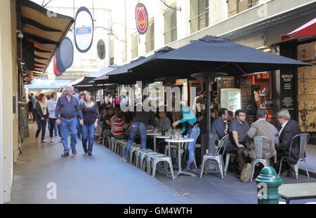 People enjoy dining in Degraves street in Melbourne Australia. Stock Photo