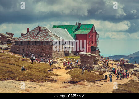 Bucegi Mountains, Romania - August 6, 2016: Thousands of tourists hike the trails to the Babele (The Old Women) chalet at 2206 m altitude. Stock Photo