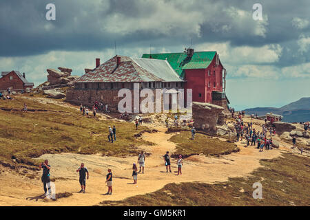 Bucegi Mountains, Romania - August 6, 2016: Thousands of tourists hike the trails to the Babele (The Old Women) chalet at 2206 m altitude. Stock Photo