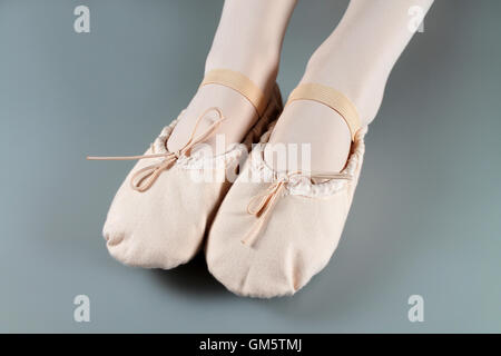 Close up of legs in ballet slippers Stock Photo