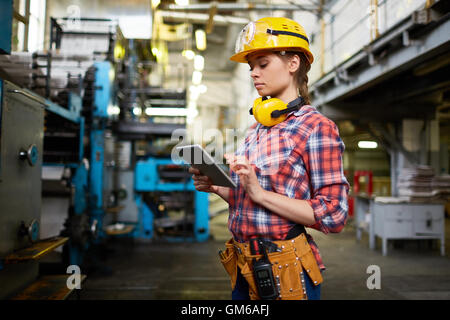 Female engineer using digital tablet for work Stock Photo