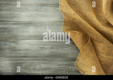 burlap hessian sacking on wooden background Stock Photo
