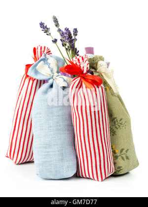 Group of decorative pouches staffed with dried lavender on white background Stock Photo