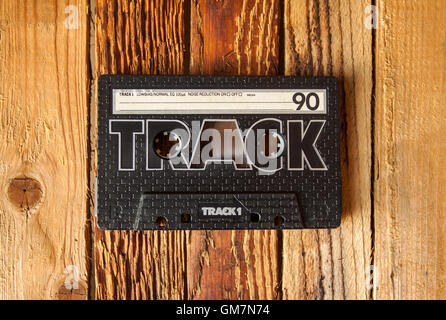 Audio cassette tape on old wooden background Stock Photo