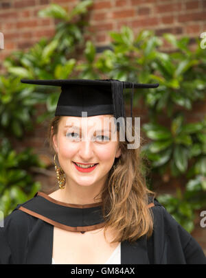 Head and shoulders portrait smiling young woman graduating, Goldsmiths, University of London, England, UK Stock Photo