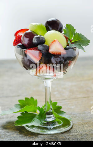 Fresh forest berries and melon  in a glass on a white background isolated Stock Photo