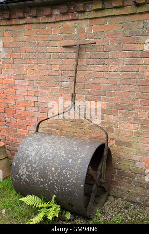 An old iron lawn roller. Stock Photo