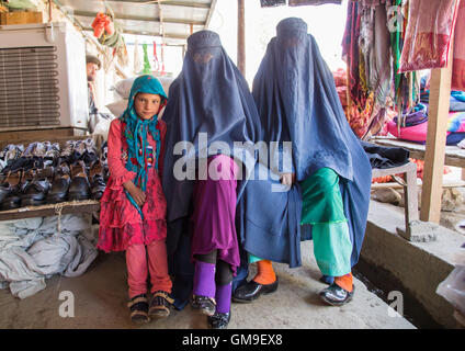 Women wearing burkas in the market, Badakhshan province, Ishkashim, Afghanistan Stock Photo